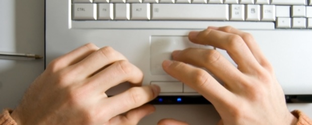 Hands typing on keyboard